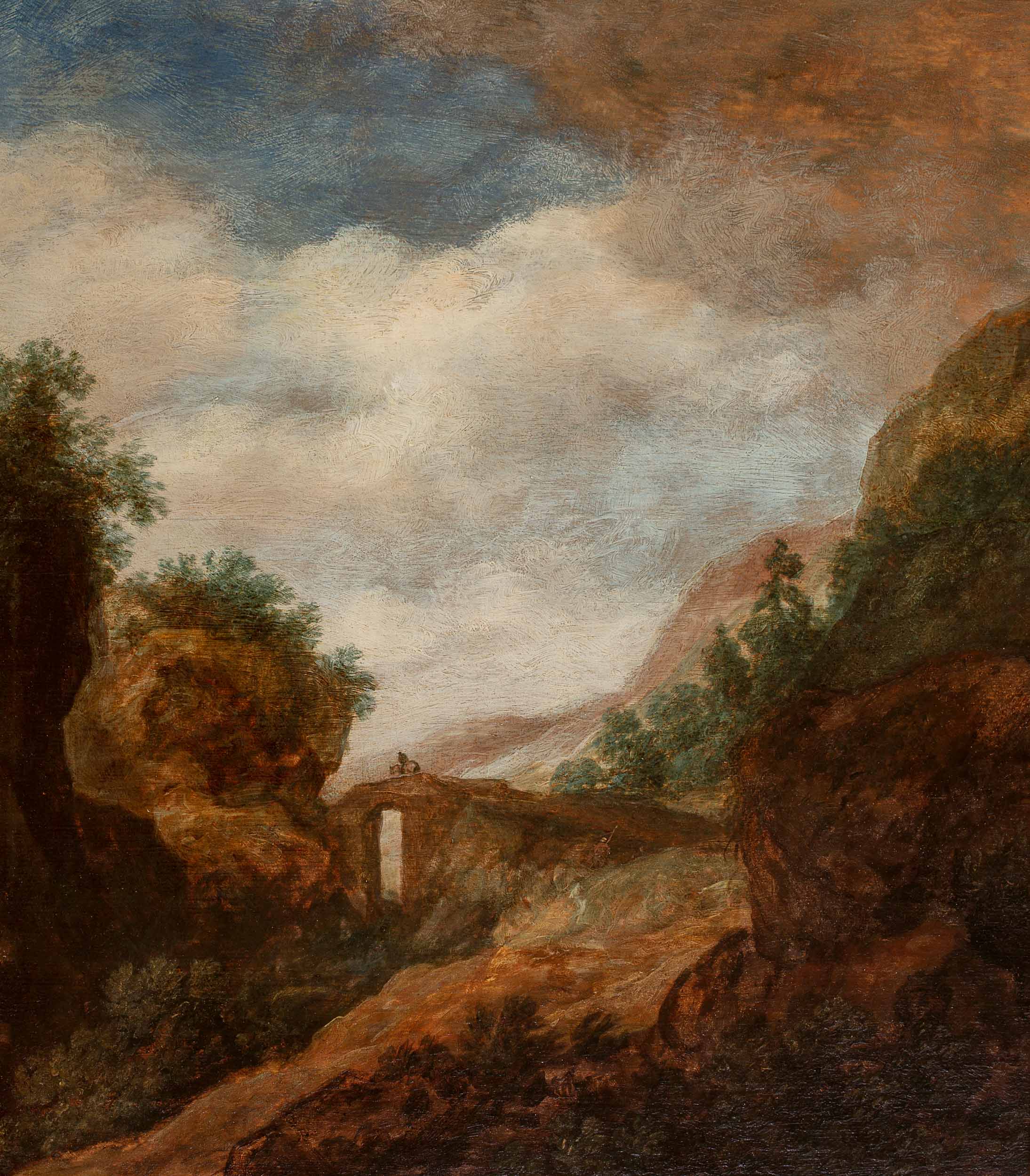 A landscape with a horse rider on a bridge
