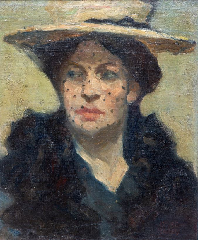 An elegant lady wearing a hat and voile