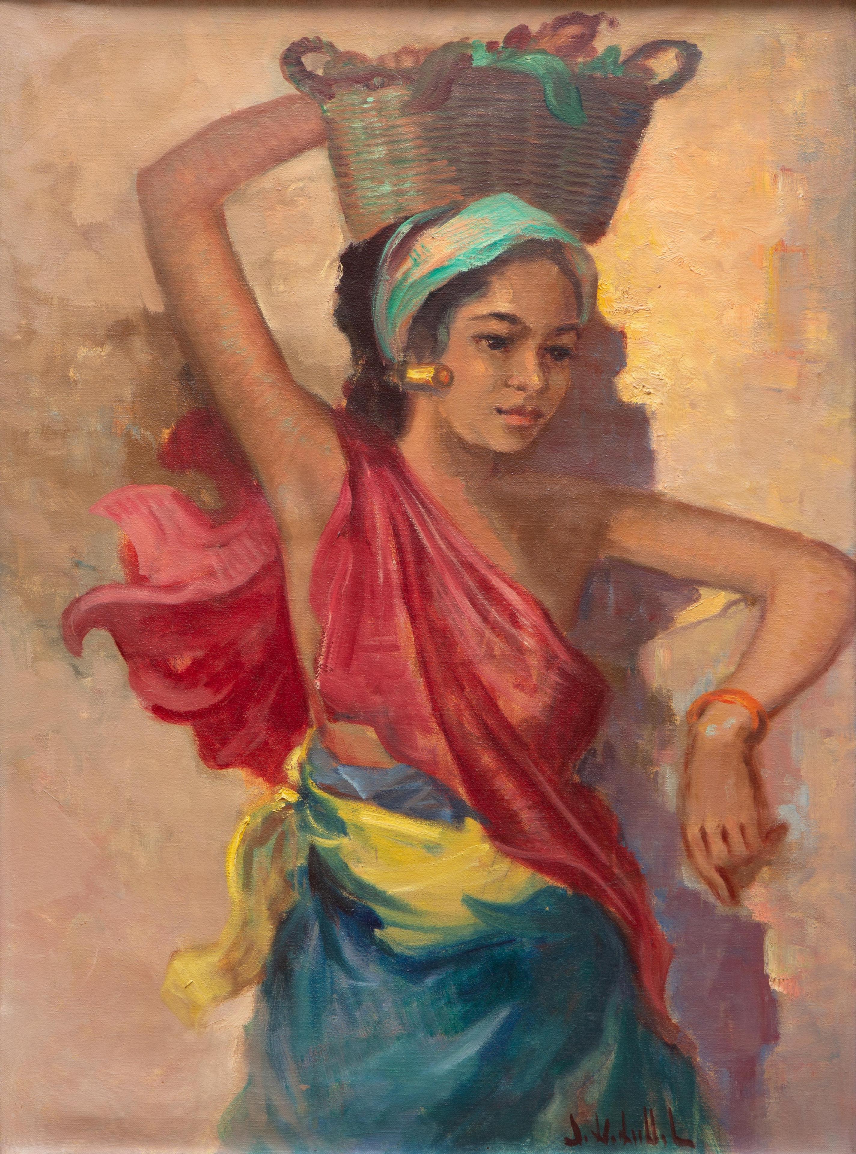 A Balinese girl carrying a basket on her head