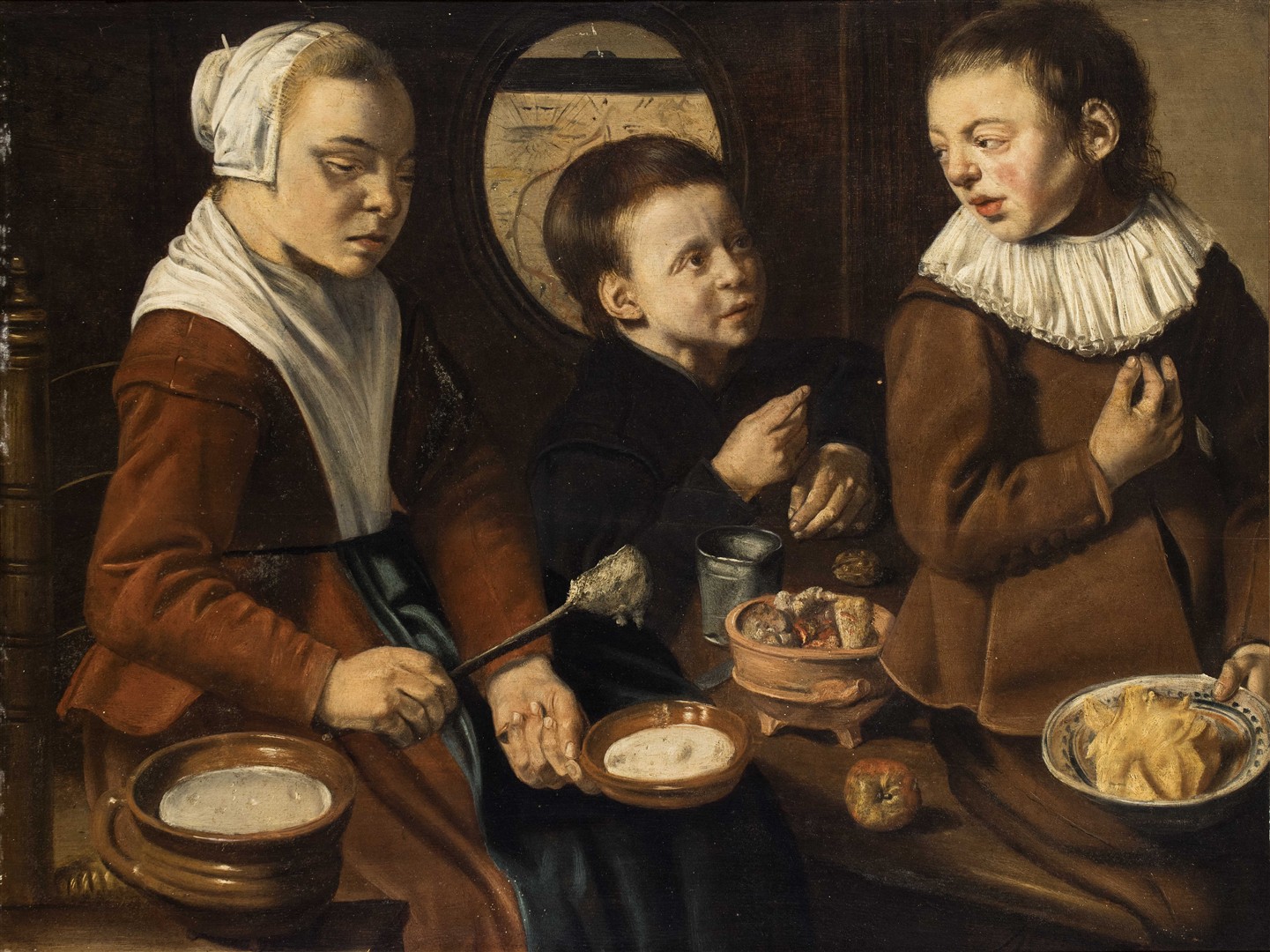 Dienstmaagd en twee kinderen in de keuken