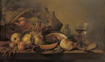 Quinces, Peaches, A Sliced Melon On A Silver Plate, A Bread Roll, A Leg Of Ham On A Pewter Plate, A Knife, A `roemer` Of White Wine, A Stoneware Jug And A Basket Of Fruit, All On A Table