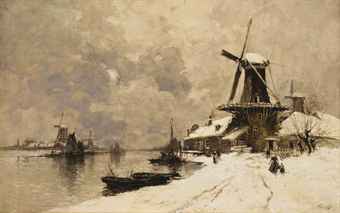 Windmills along a canal in winter Windmills along a canal in winter